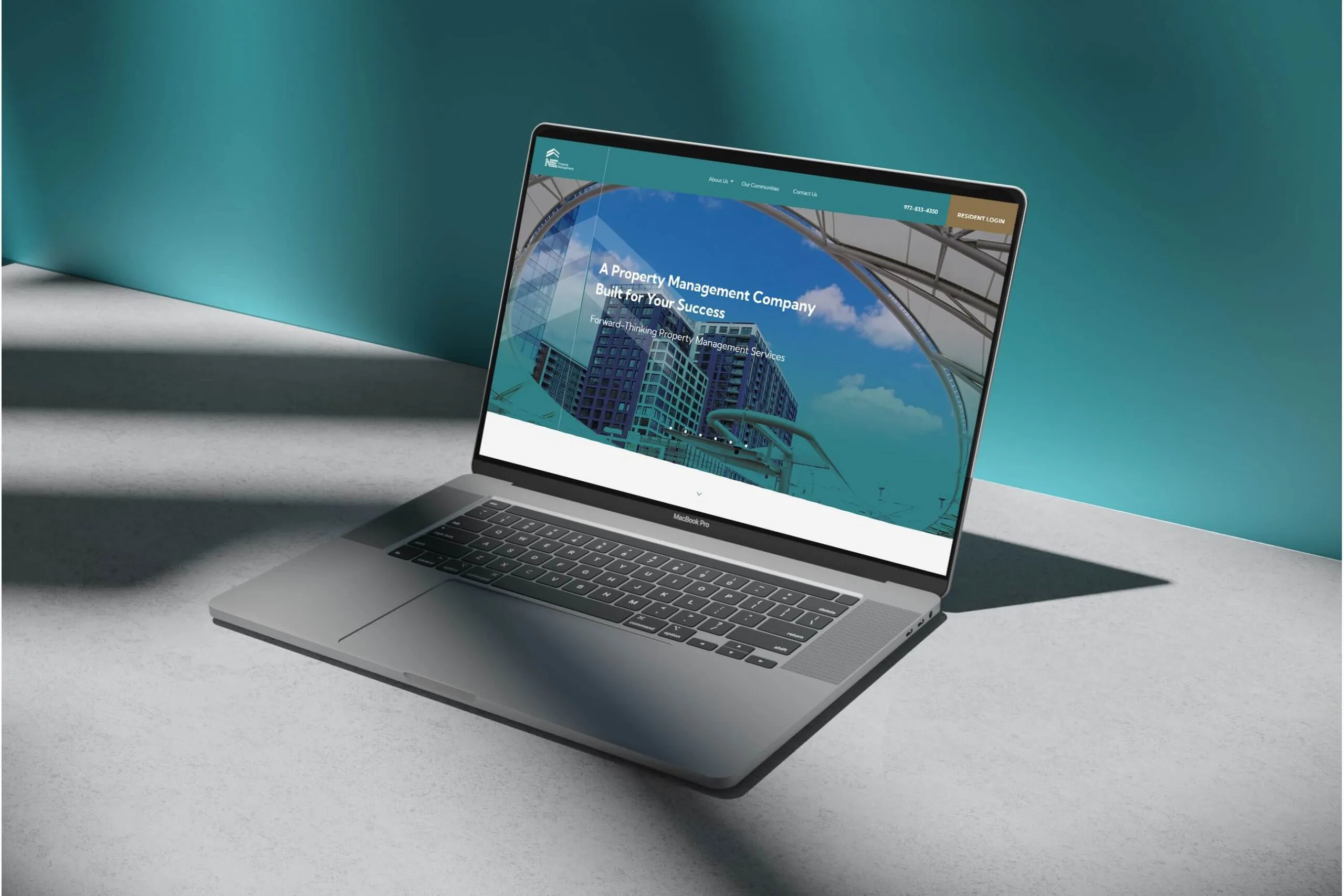 Laptop showing a property management company website designed by Criterion.B